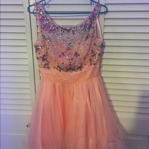 Peach dress with colorful detailing. Worn once